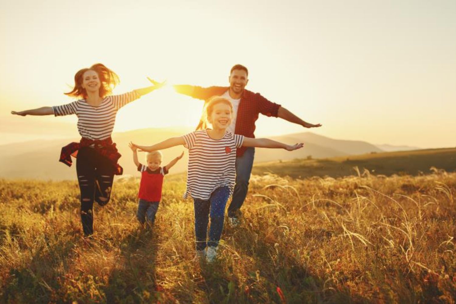 families running with arms wide open Photo by Evgeny Atamanenko on shutterstock