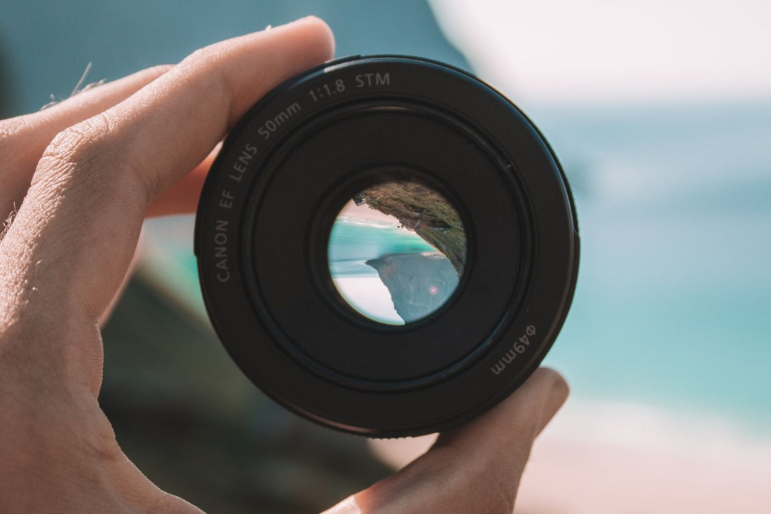 Photo of a hand holding UV lens filter by Guillaume Briard on Unsplash