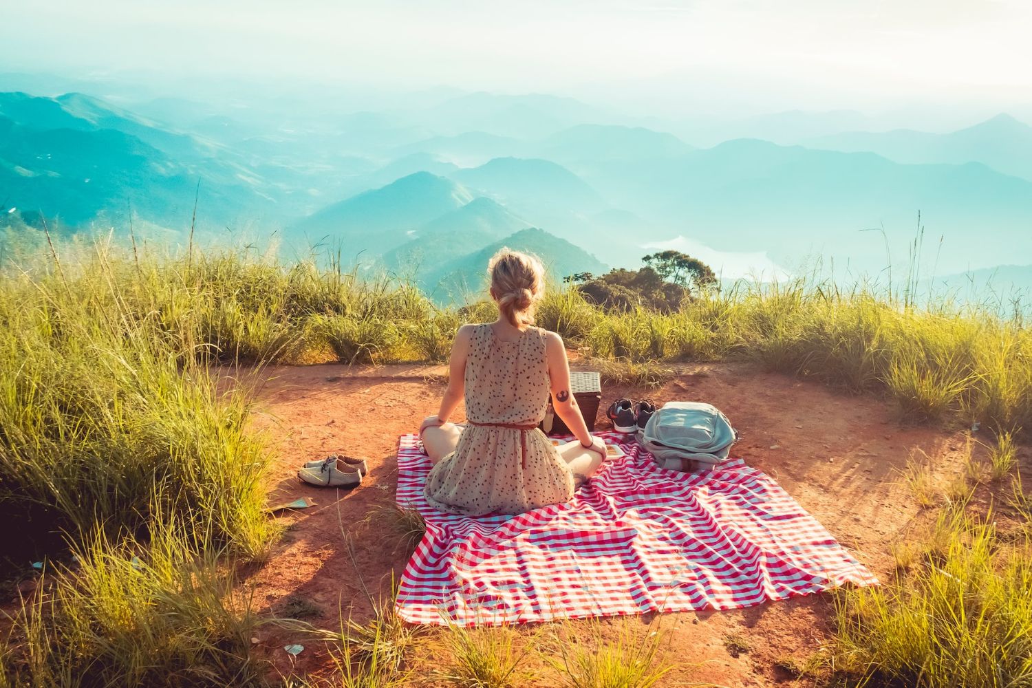 picnic photo of a girl on the hill by Willian Justen de Vasconcellos on Unsplash  
