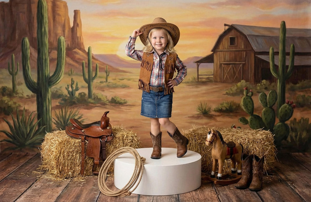 Child posing on a white display platform in a Western-themed photography set