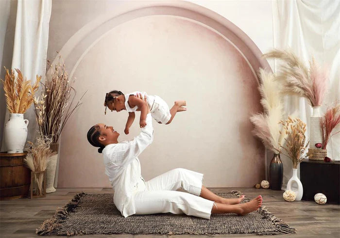 mum lifting her kid during a mum-and-me boho session