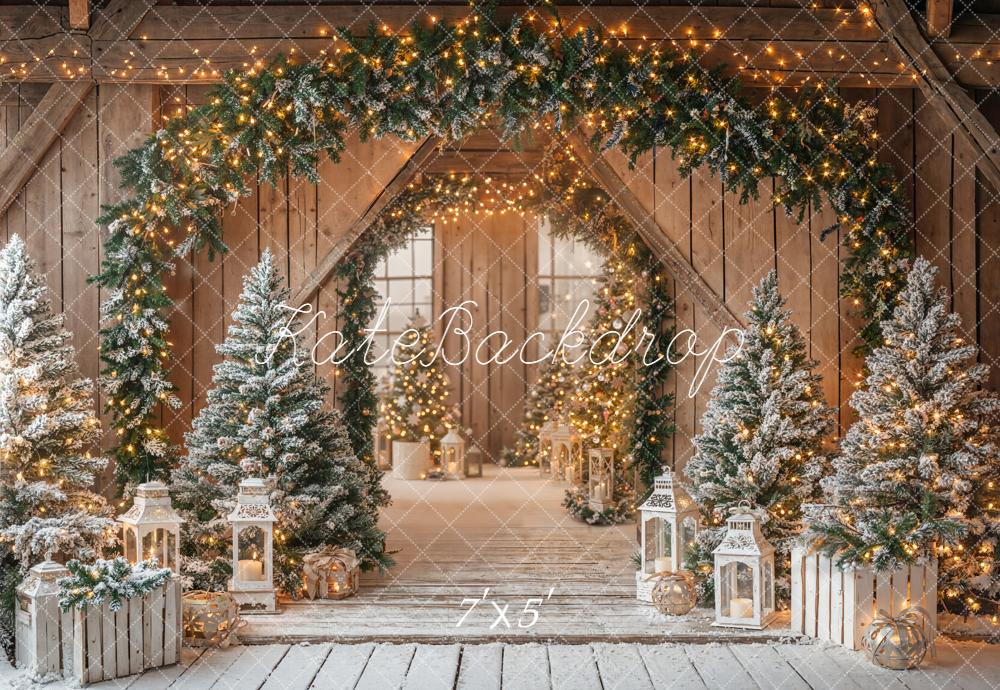 Kate Christmas Barn Garland Arch Snowy Pine Trees Lanterns Rustic Backdrop Designed by Emetselch