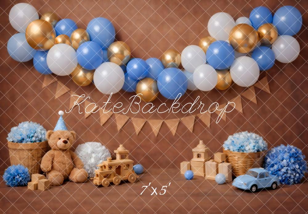 Kate Cake Smash Blue Gold Balloon Garland Teddy Bear Toy Car Brown Printed Backdrop Designed by Vertigo Productions