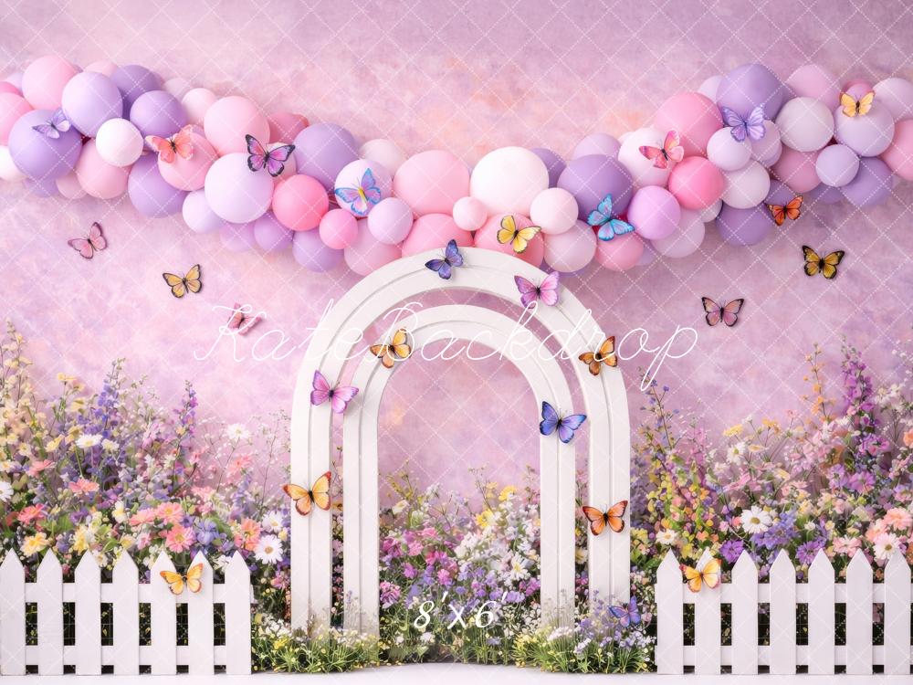 Kate Spring Flower Arch Pastel Balloons Butterflies White Fence Printed Backdrop Designed by Megan Leigh Photography