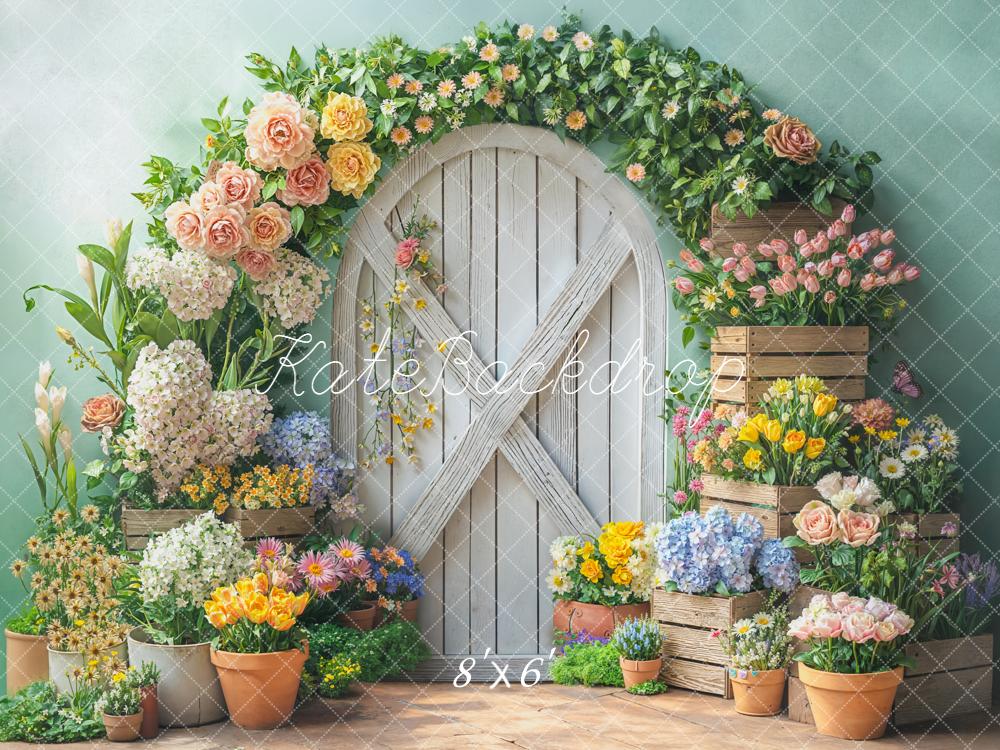 Kate Spring Flower Arch White Door Wooden Crates Pastel Green Backdrop Designed by Emetselch