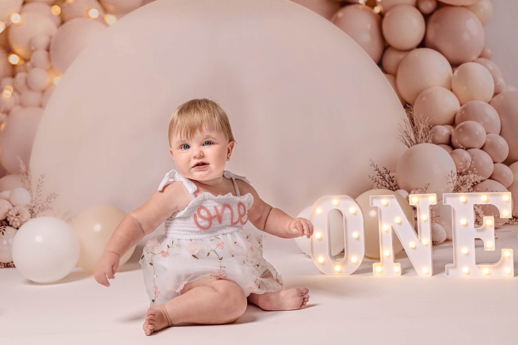 Kate Cake Smash Neutral Balloon Garland with Flowers and Lights Printed Backdrop Designed by Emetselch