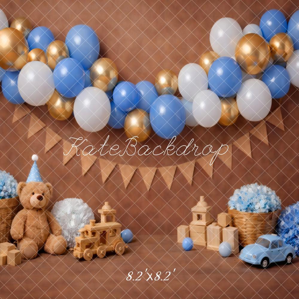 Kate Cake Smash Blue Gold Balloon Garland Teddy Bear Toy Car Brown Printed Backdrop Designed by Vertigo Productions