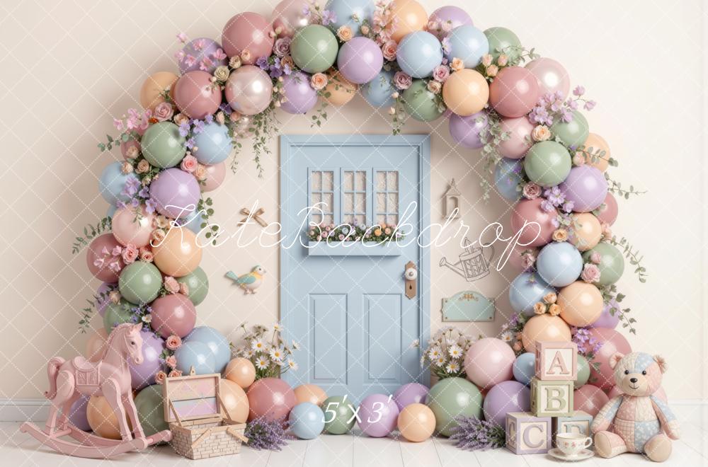 Kate Spring Birthday Pastel Balloon Flower Arch Blue Door Rocking Horse Teddy Bear Printed Backdrop Designed by Mini MakeBelieve