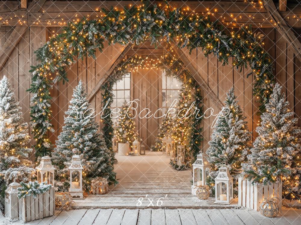 Kate Christmas Barn Garland Arch Snowy Pine Trees Lanterns Rustic Backdrop Designed by Emetselch