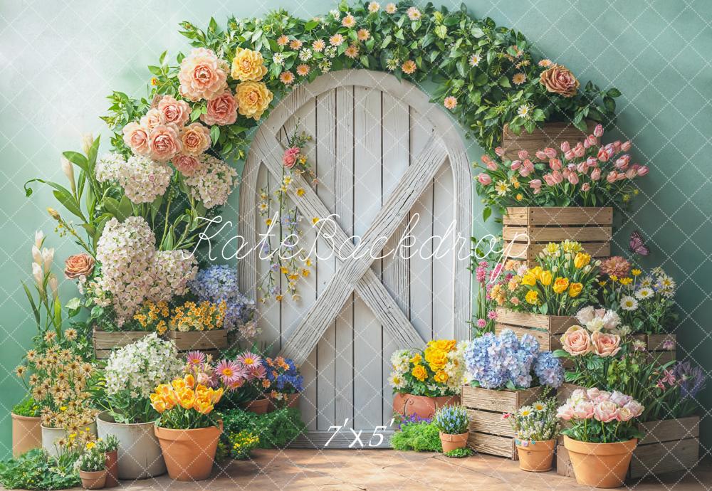 Kate Spring Flower Arch White Door Wooden Crates Pastel Green Backdrop Designed by Emetselch