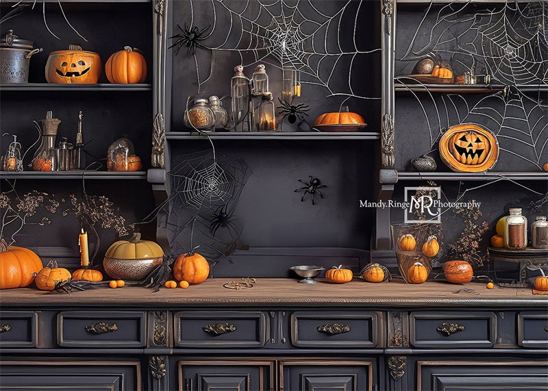 Kate Spooky Kitchen with Spiderwebs and Pumpkin Backdrop Designed by Mandy Ringe Photography