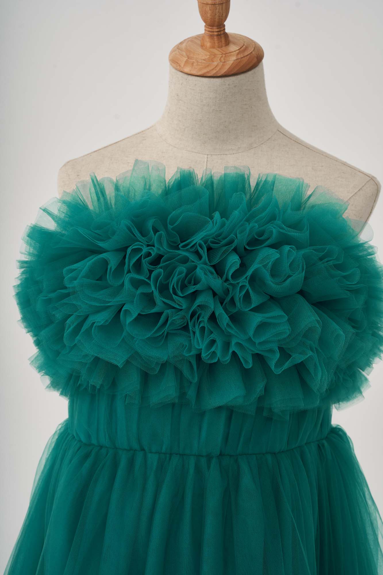 Front detail of green spring tulle maternity dress