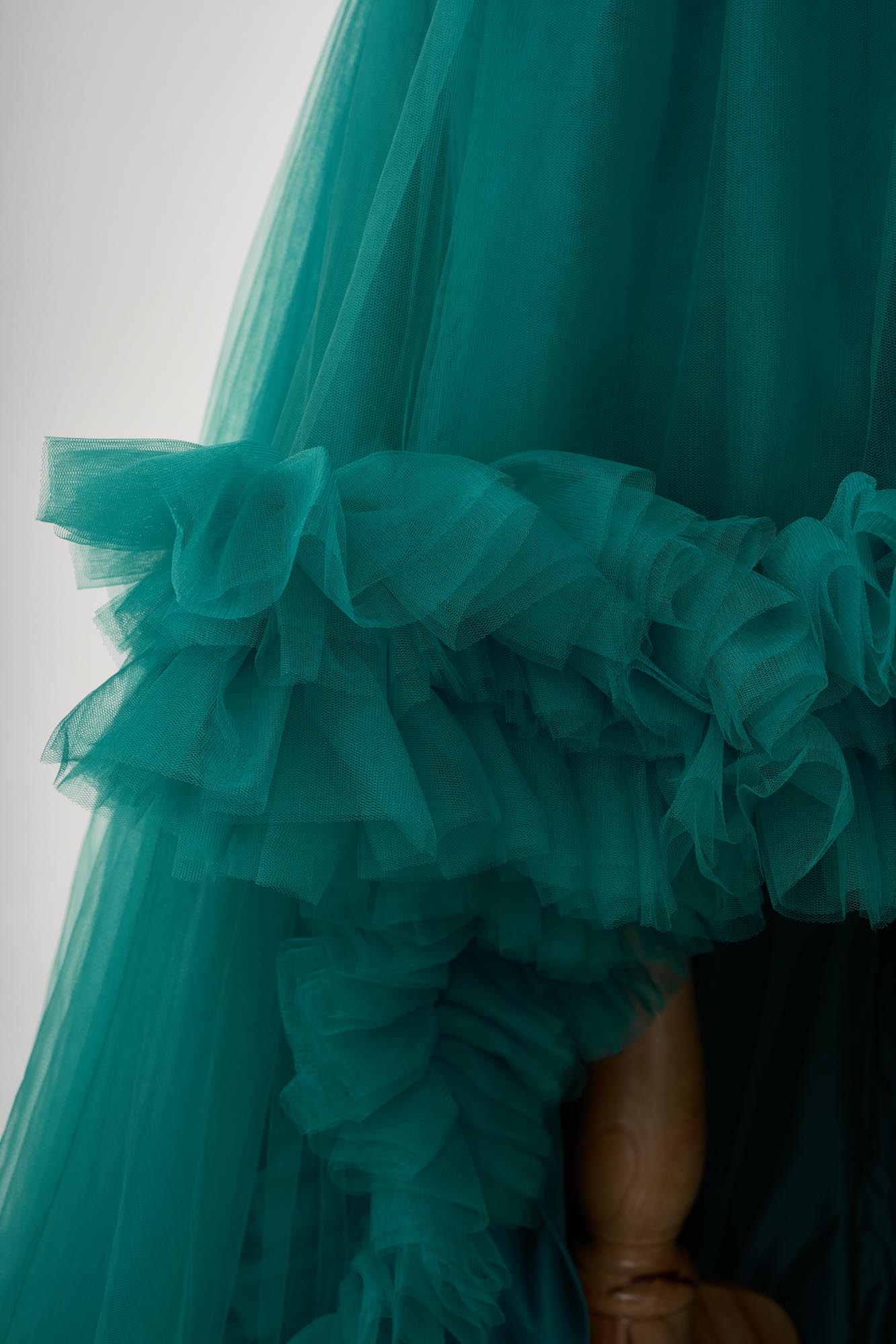 Detail of green spring tulle maternity dress