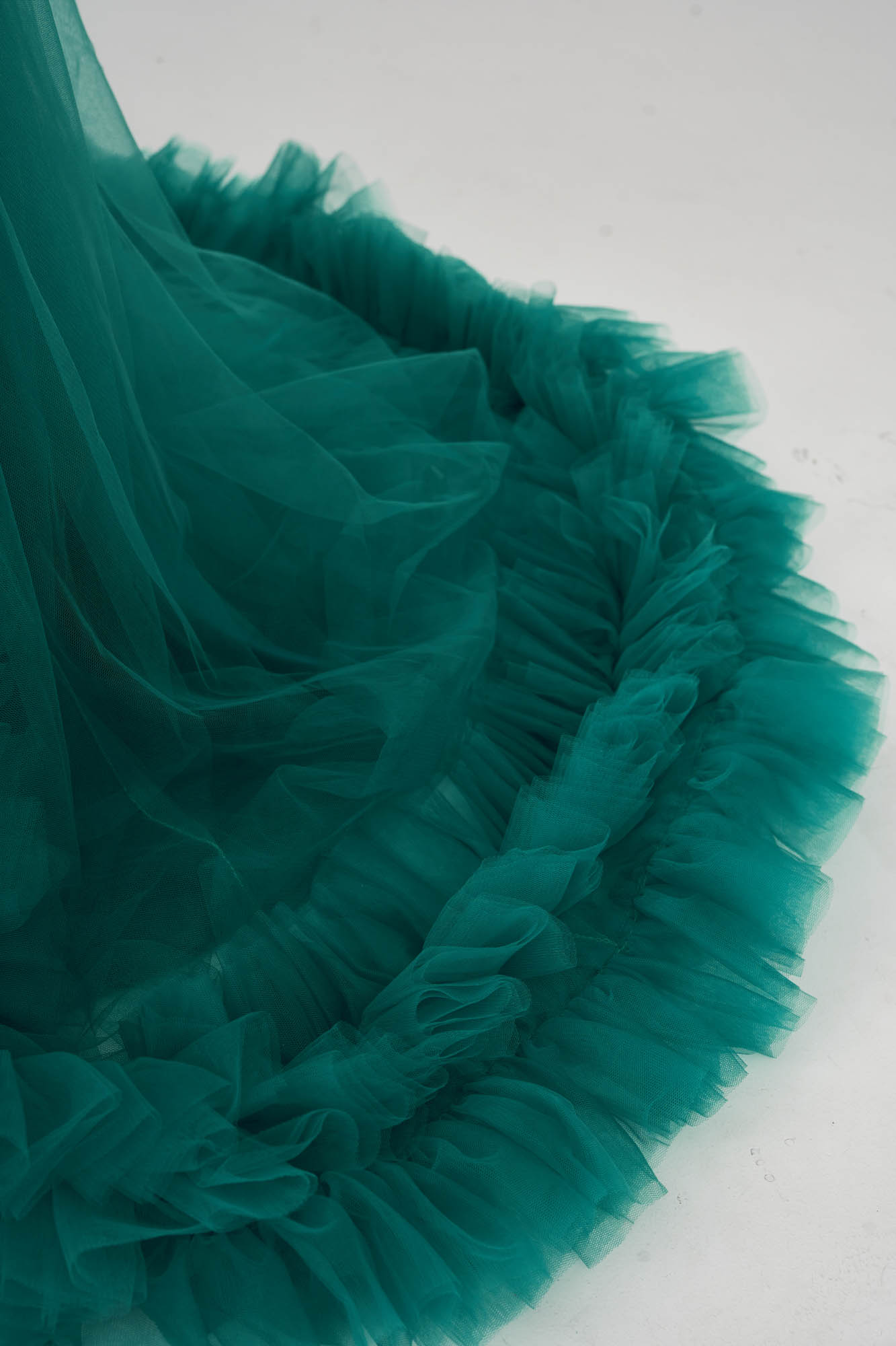 Detail of green spring tulle maternity dress