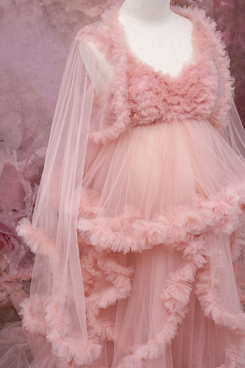 Side detail shot of pink one-shoulder mesh maternity dress