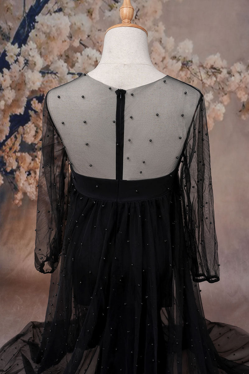 Detail shot of black one-shoulder mesh maternity dress 