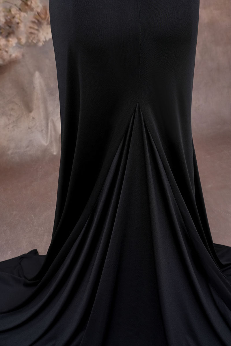 Detail shot of black one-shoulder satin maternity dress