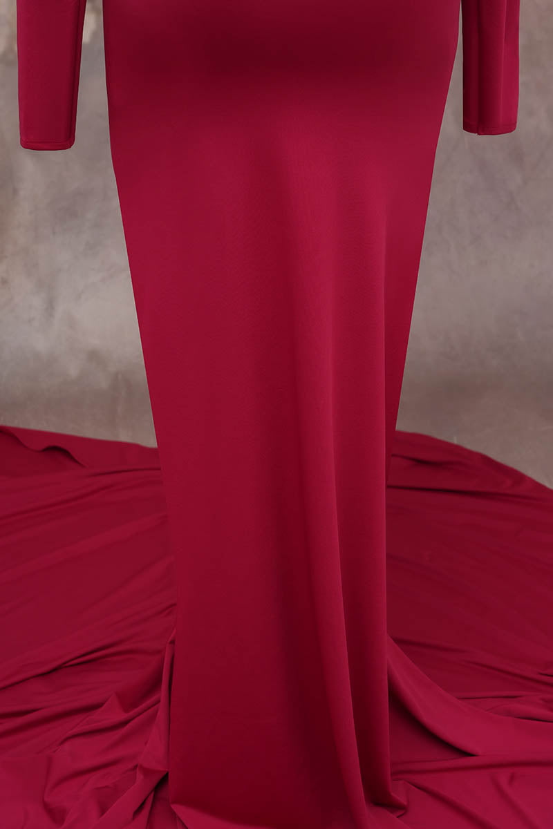 Detail shot of red long sleeve satin maternity dress