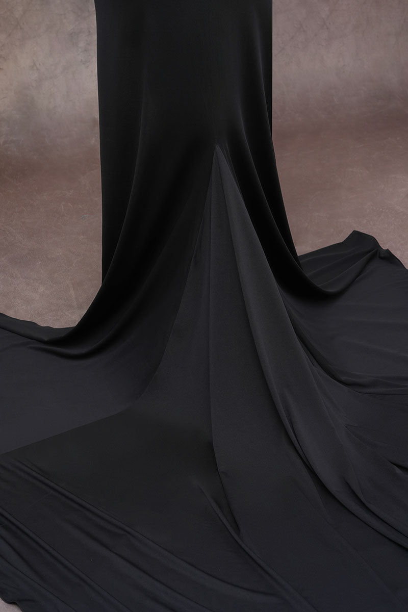 Detailed photo of black long-sleeved satin maternity dress skirt