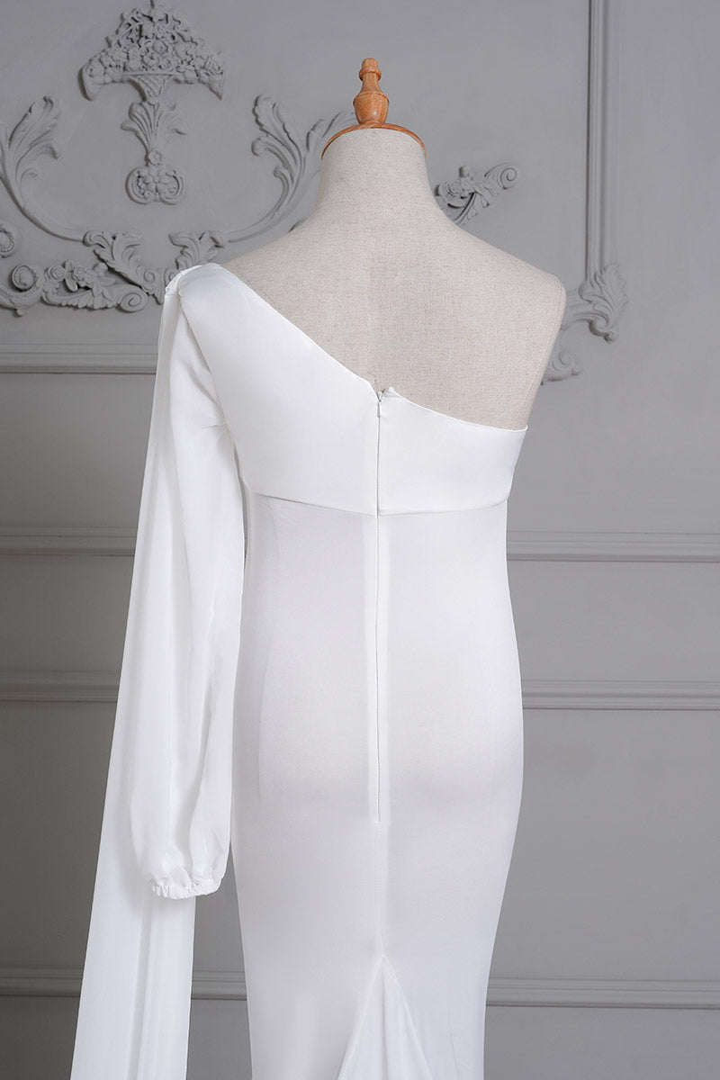 Detail shot of the back of a white one-shoulder satin maternity gown