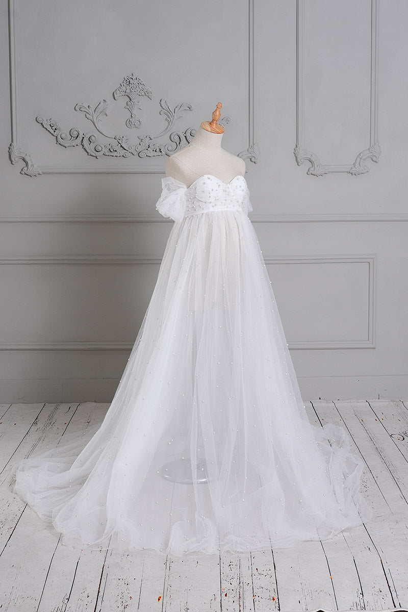 Side view of white sheath mesh maternity dress