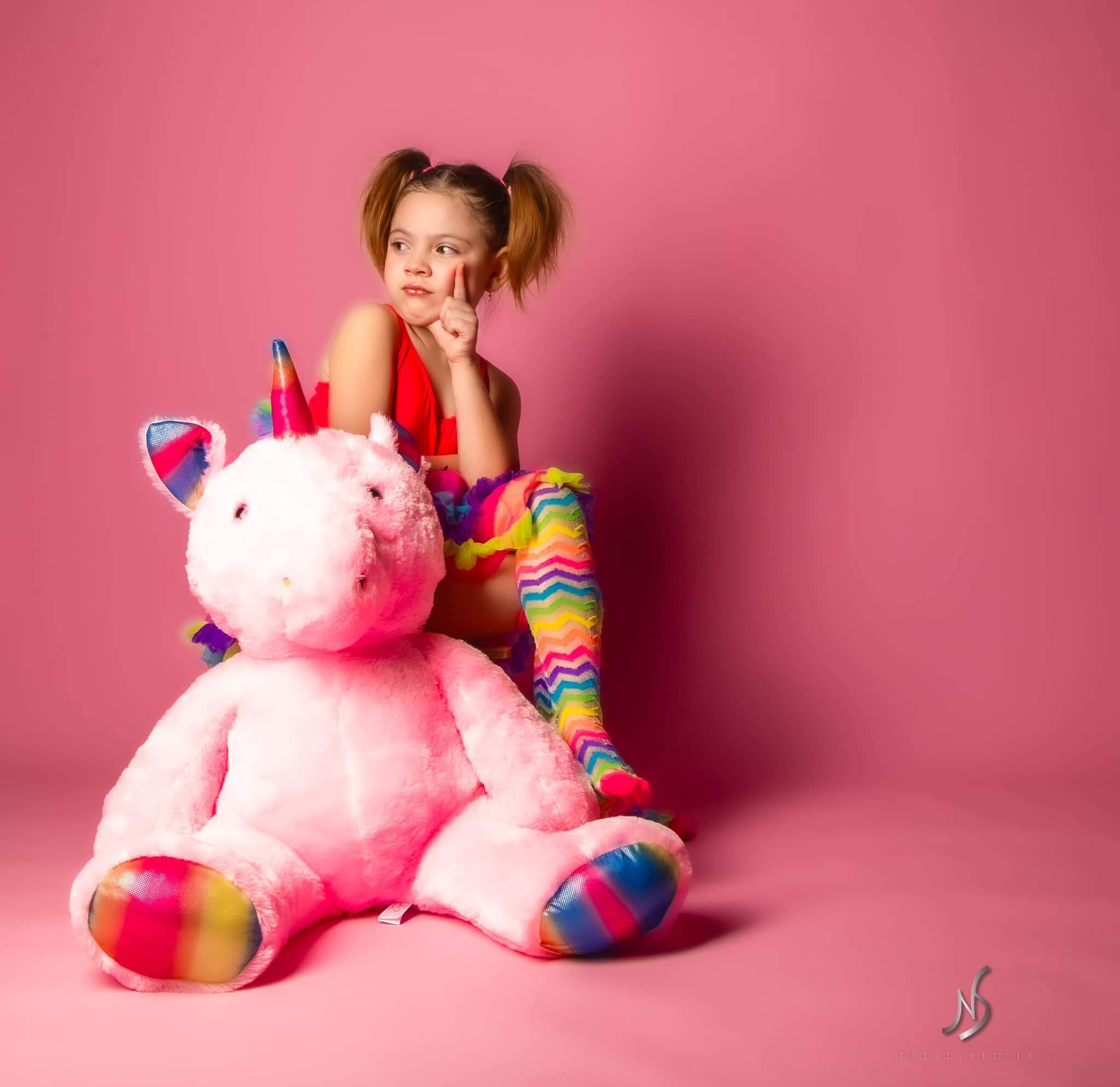 girl takes photos with Kate Baby Pink Seamless Paper Backdrop