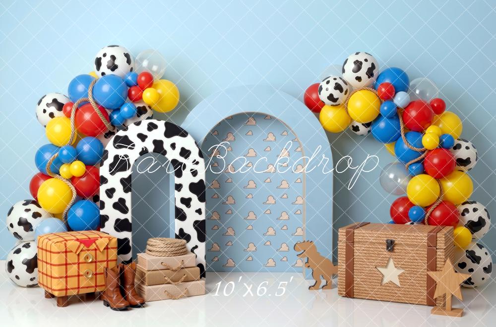 Kate Birthday Cowboy Cow Print Arch Balloons Toy Chest Blue Clouds Printed Backdrop Printed Backdrop Designed by Mini MakeBelieve