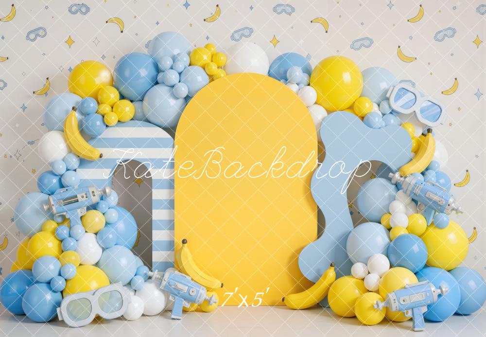 Kate Cake Smash Playful Banana Goggles Balloon Arch Yellow Blue Printed Backdrop Designed by Mini MakeBelieve