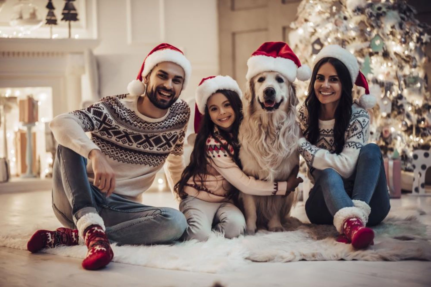 family snuggling with their dog photo by 4 PM production on shutterstock