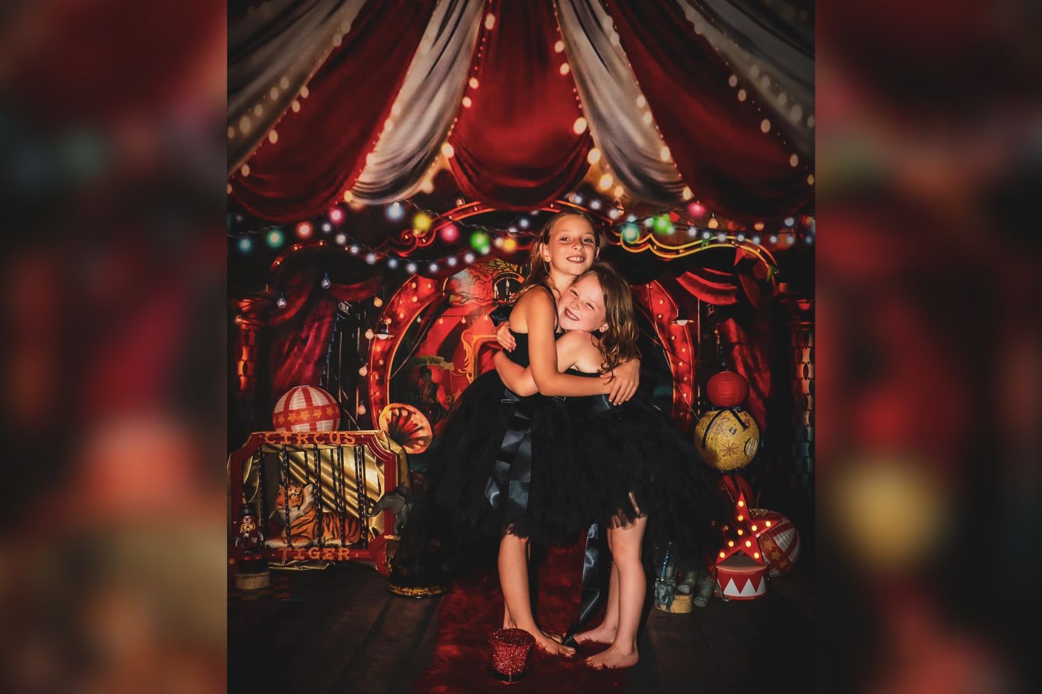 photo of two little girls holding together with Kate Circus Backdrop Designed by Rosabell Photography