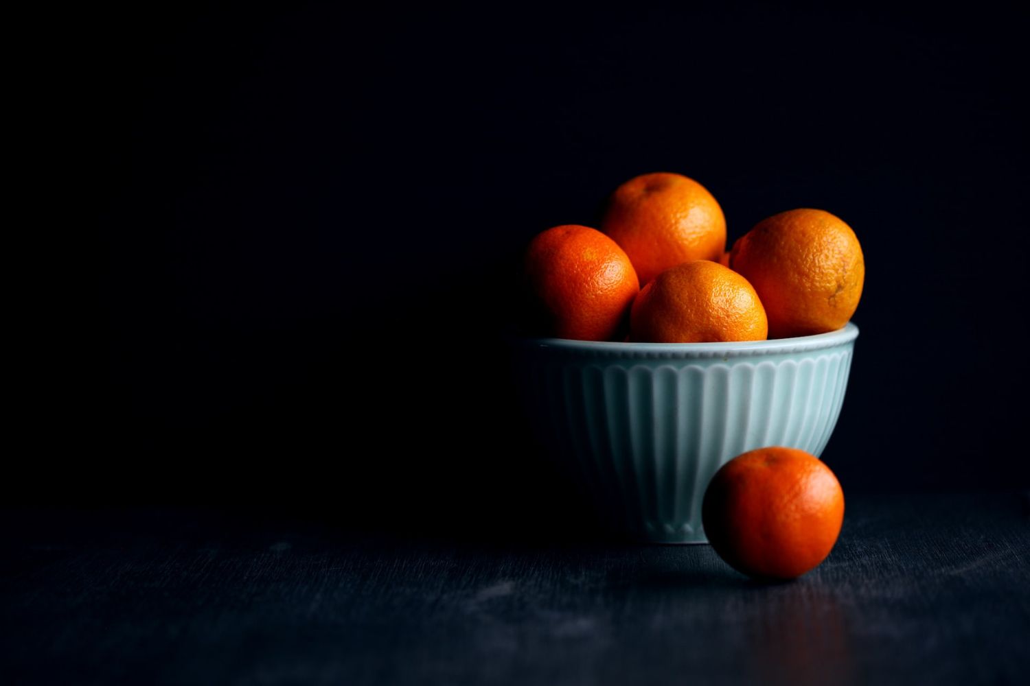 still photo of oranges in bowl by Alexander Grey on Unsplash