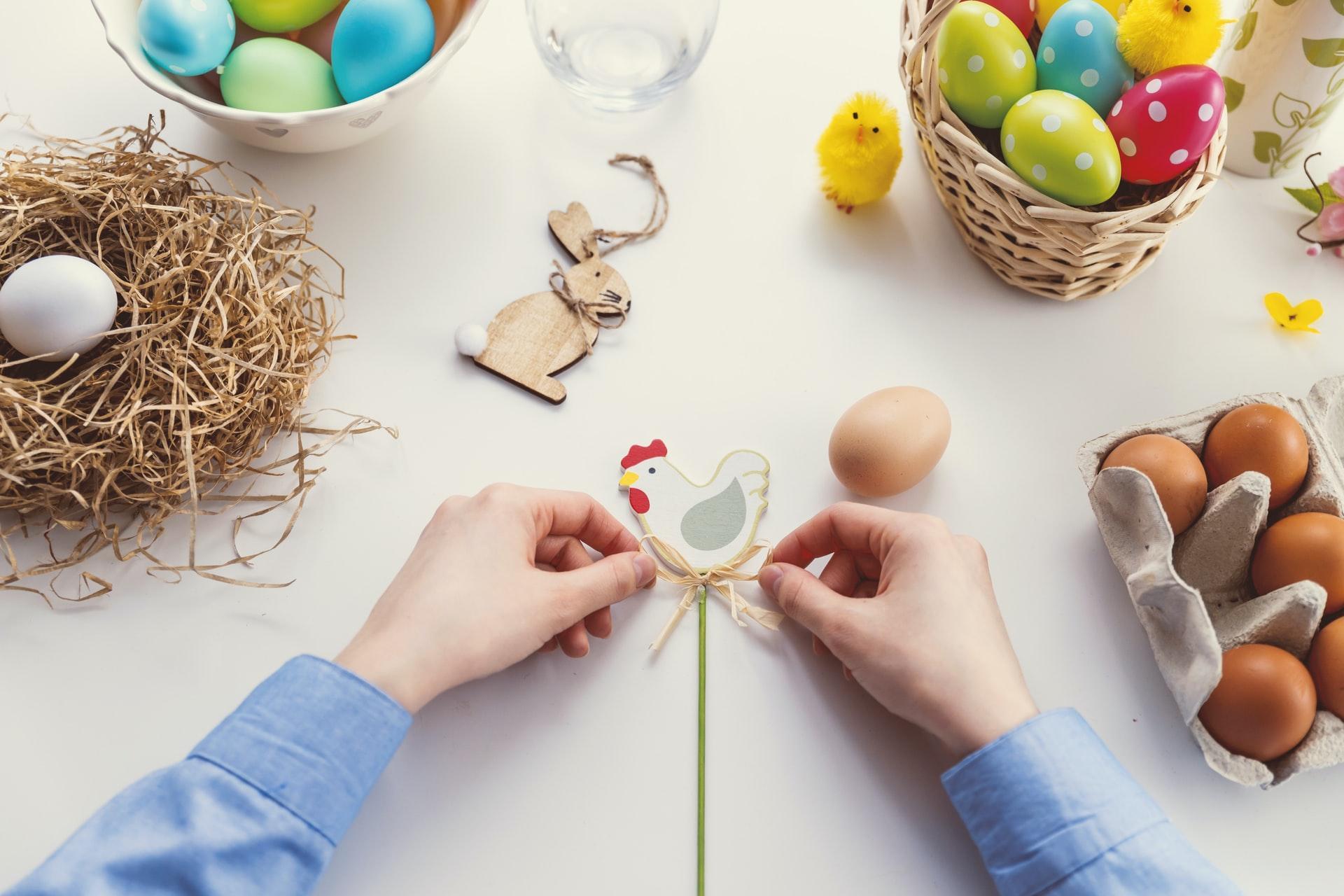 kid making DIY Easter outdoor decorations 