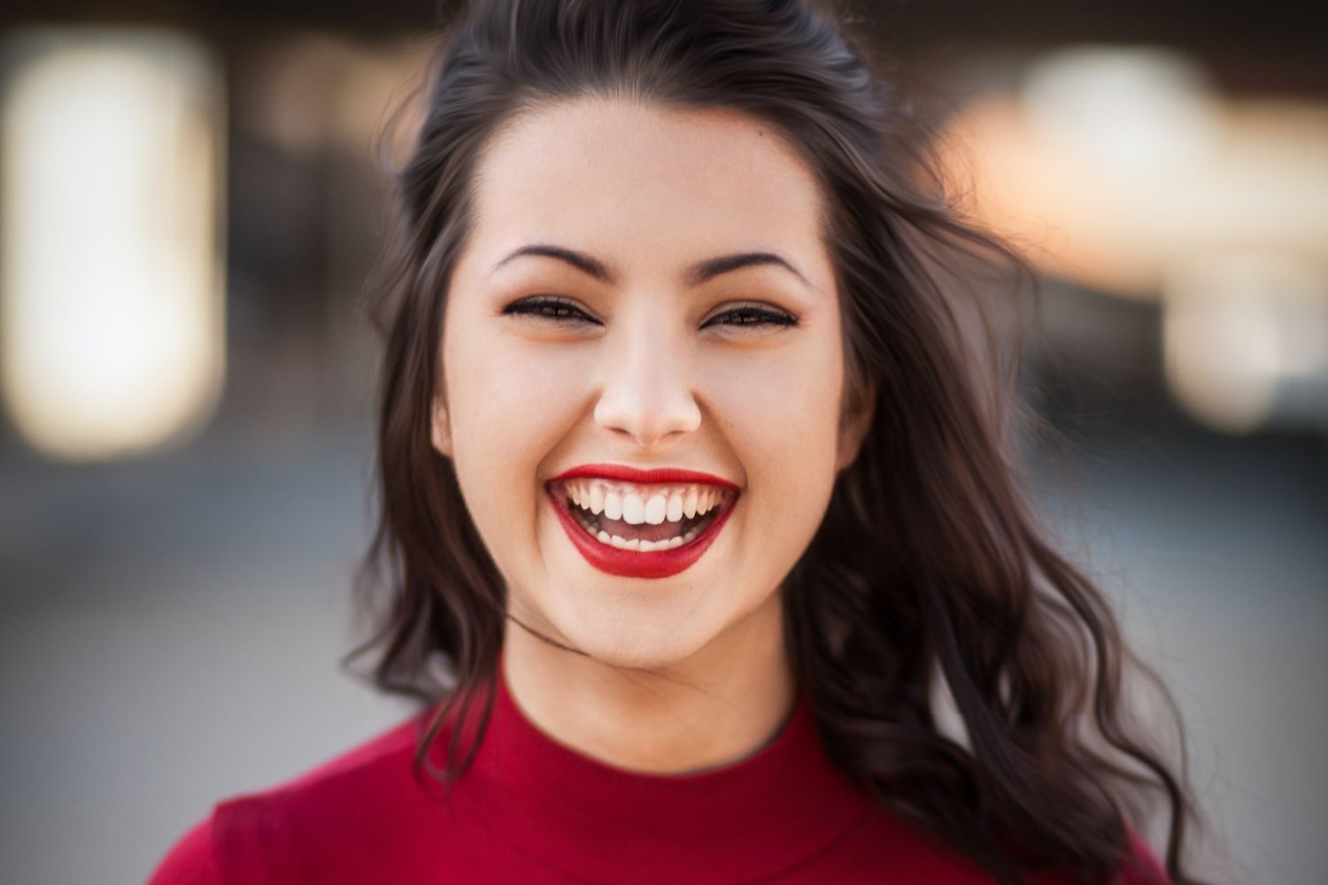 a happily laughing woman with white teeth Photo by Michael Dam on Unsplash