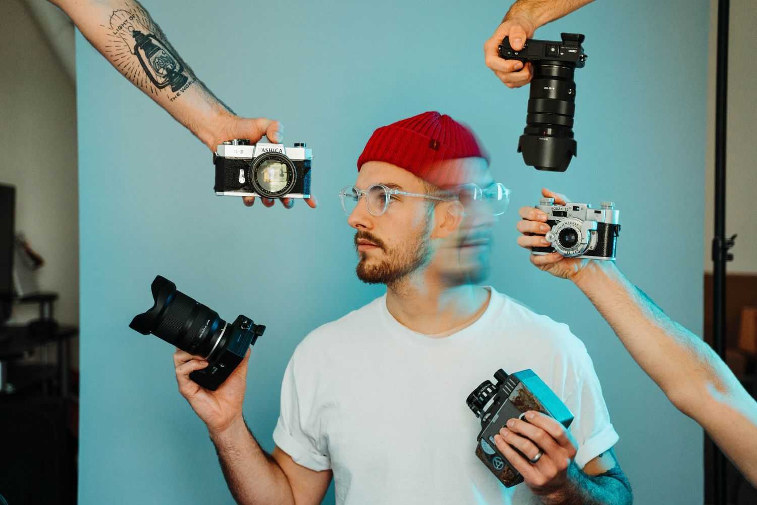 man faces multiple camera choices Photo by Ben Eaton on unsplash