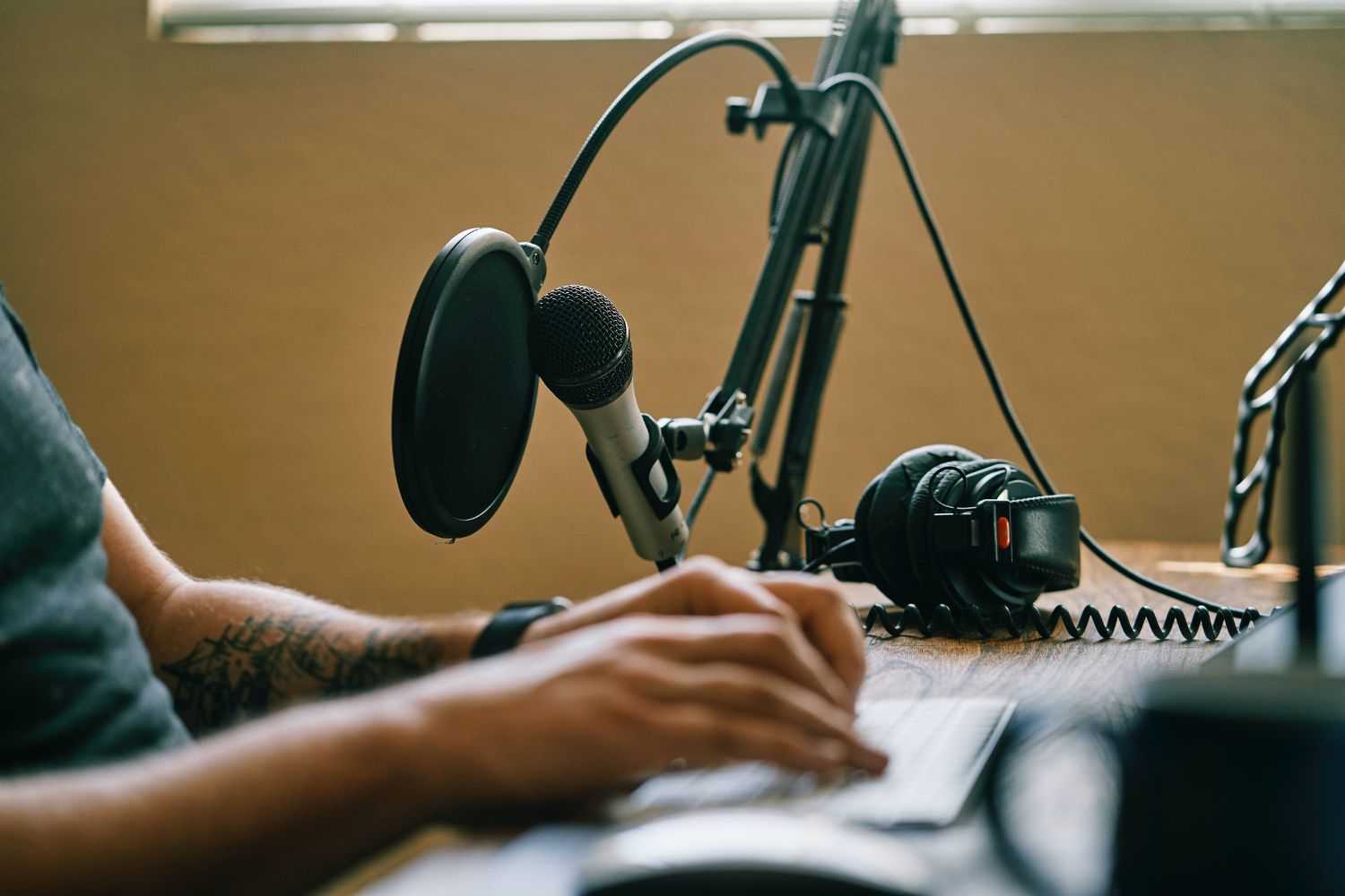 work in studio with microphone Photo by Convertkit on unsplash