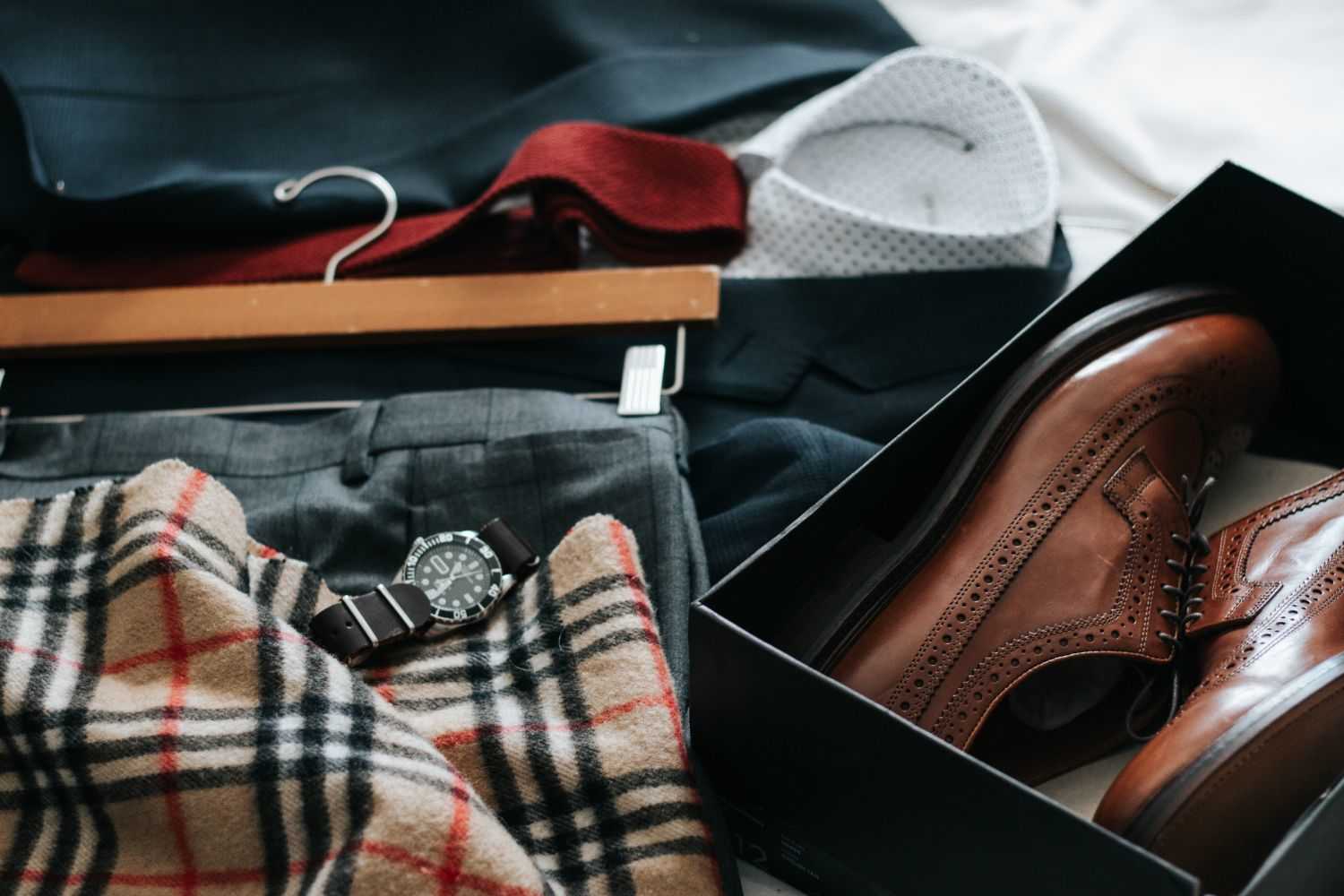 shoes,clothes and scarf on the desk Photo by David Lezcano on unsplash