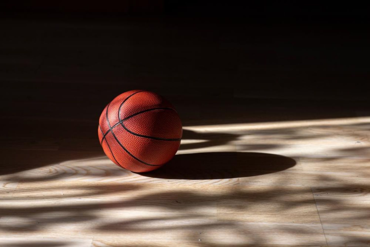basketball on floor photo by sportoakimirka on shutterstock