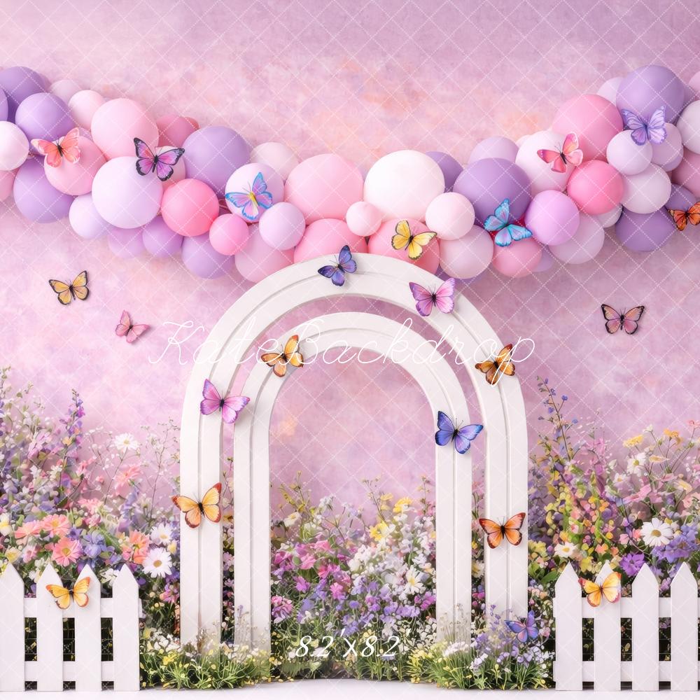 Kate Spring Flower Arch Pastel Balloons Butterflies White Fence Printed Backdrop Designed by Megan Leigh Photography