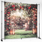 floral arch backdrop hanging on a photography stand
