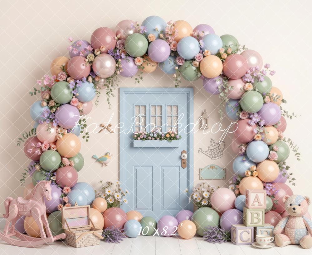 Kate Spring Birthday Pastel Balloon Flower Arch Blue Door Rocking Horse Teddy Bear Printed Backdrop Designed by Mini MakeBelieve
