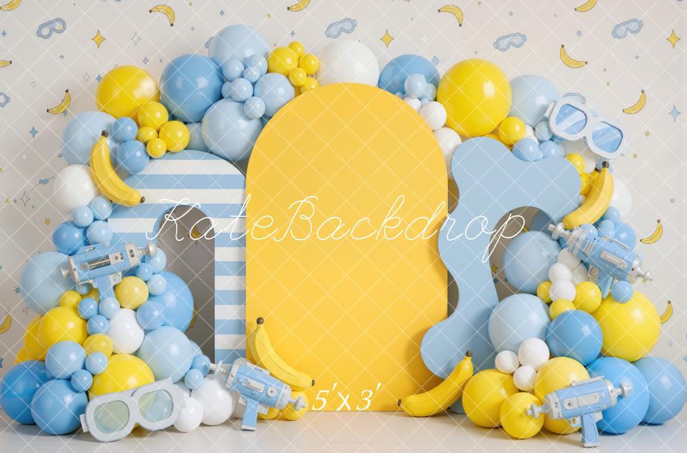 Kate Cake Smash Playful Banana Goggles Balloon Arch Yellow Blue Printed Backdrop Designed by Mini MakeBelieve