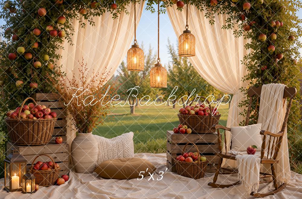 Kate Fall Picnic Apple Arch White Drapes Cozy Chair Baskets Crates Lanterns Printed Backdrop Designed by Ashley Ward