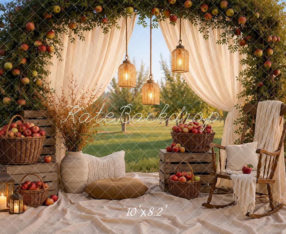 Kate Fall Picnic Apple Arch White Drapes Cozy Chair Baskets Crates Lanterns Printed Backdrop Designed by Ashley Ward