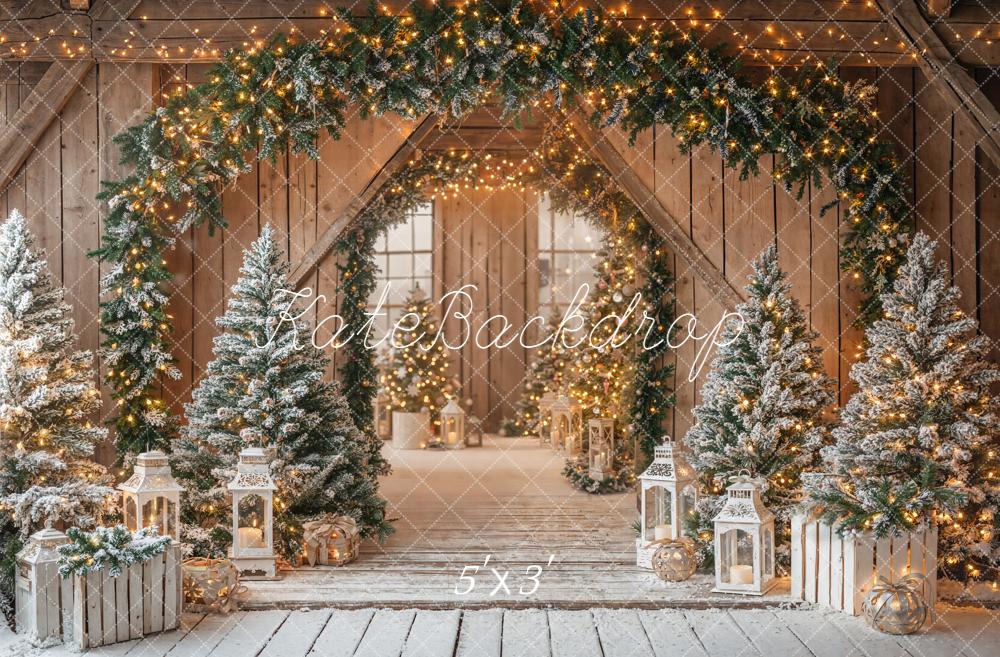 Kate Christmas Barn Garland Arch Snowy Pine Trees Lanterns Rustic Backdrop Designed by Emetselch