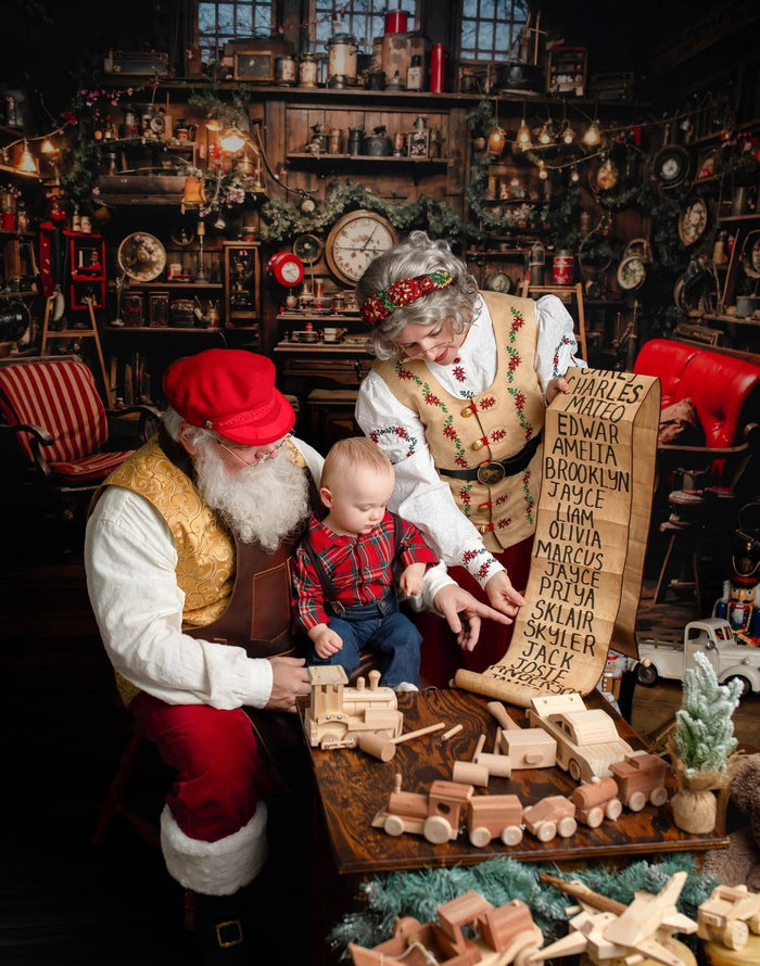 Santa playing with children in a Christmas Santa House room set