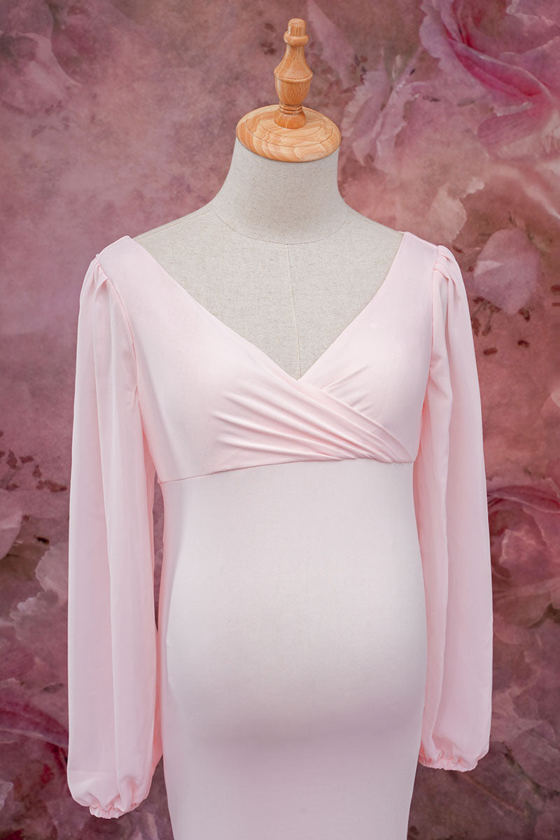 Detail shot of the front of a pink one-shoulder satin dress