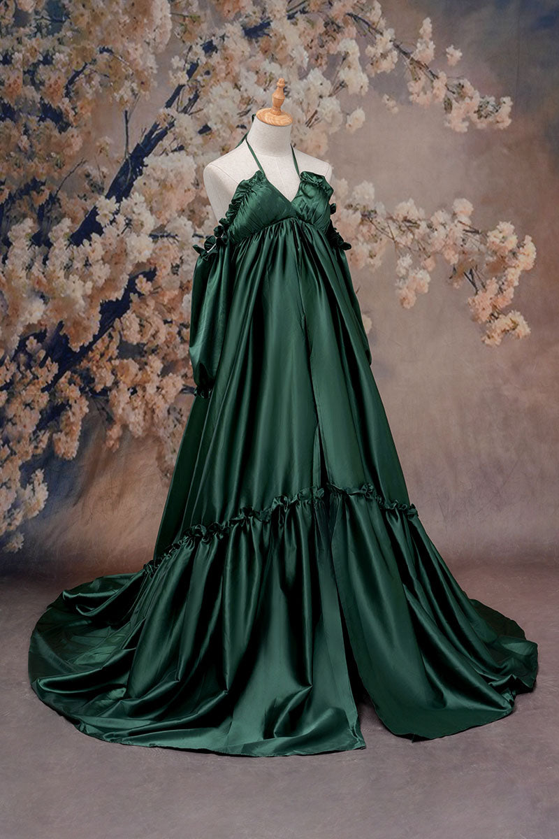 Side view of a green one-shoulder silk maternity maxi dress