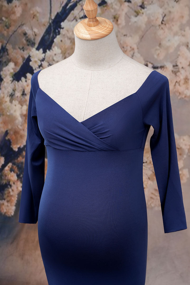 Detail shot of the front of a blue one-shoulder satin maternity gown