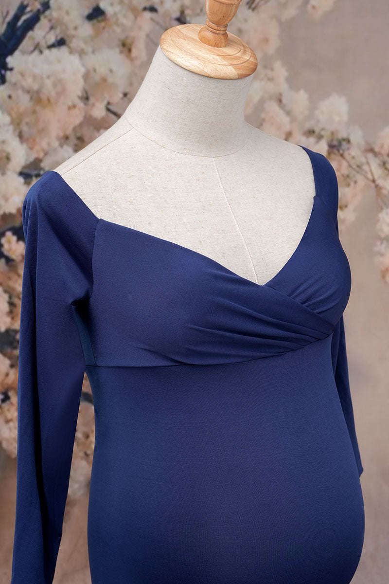 Side detail shot of a blue one-shoulder satin maternity gown