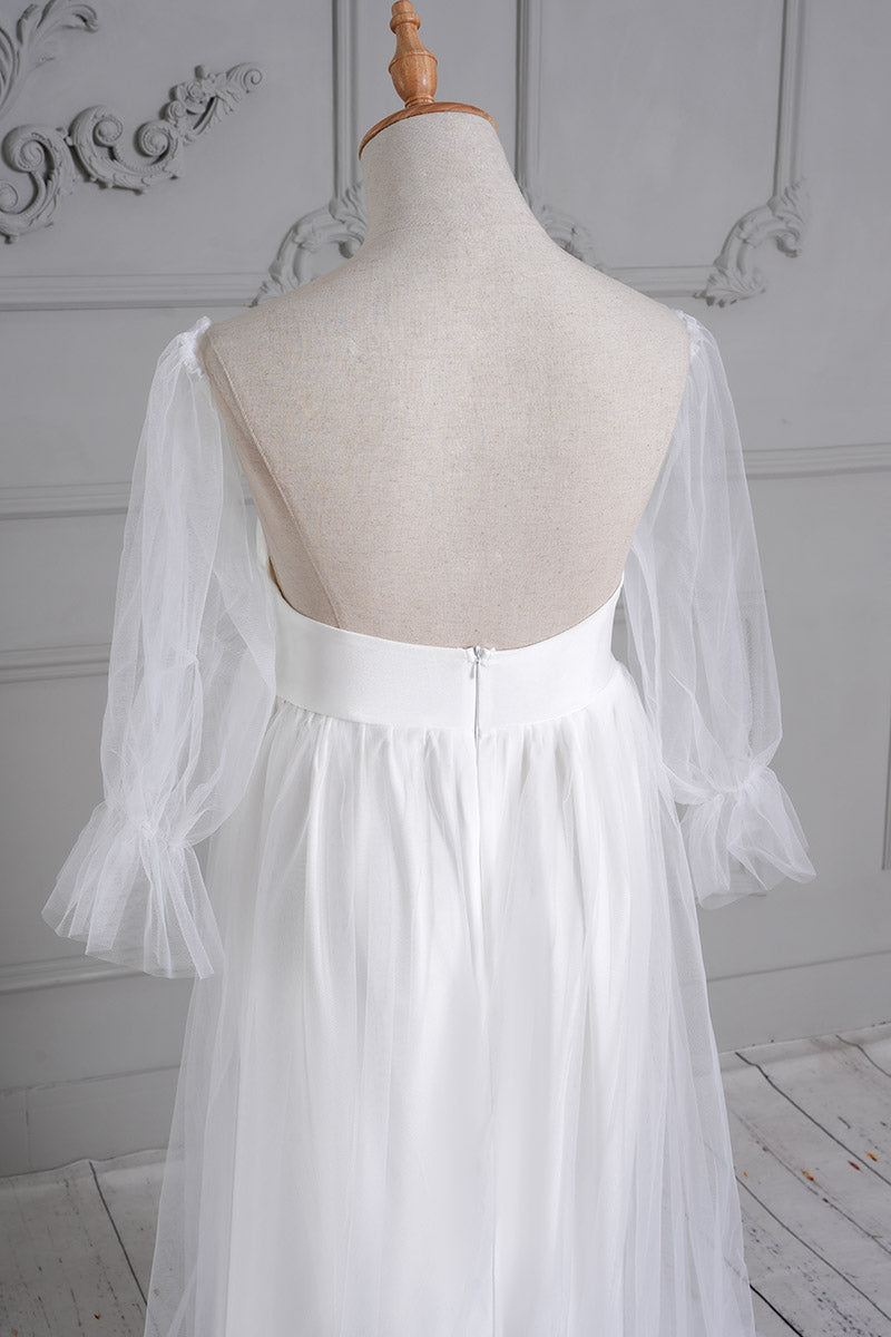 Detail shot of the back of a white tubular mesh maternity maxi dress